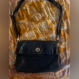Classic Tory Burch black leather fold over bag. In excellent condition.